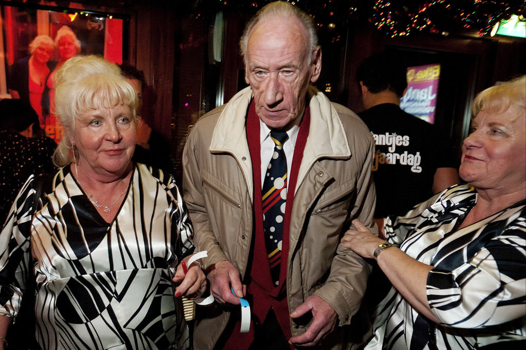 Ouwe Hoeren (Old Whores) sisters with a fan